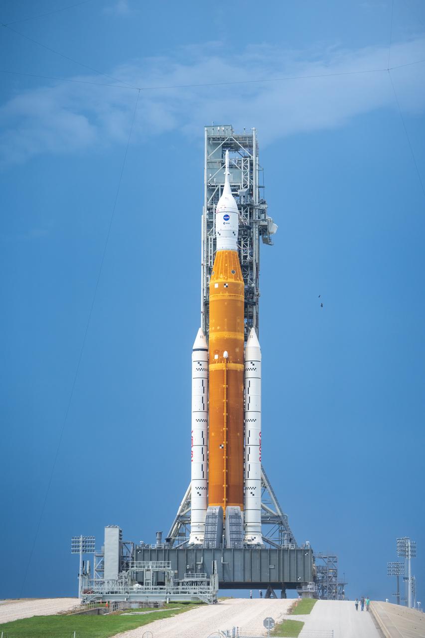 NASA’s Space Launch System (SLS) rocket with the Orion spacecraft aboard is seen atop the mobile launcher at Launch 39B at NASA’s Kennedy Space Center in Florida. Artemis I mission is the first integrated test of the agency’s deep space exploration systems: the Space Launch System rocket, Orion spacecraft, and supporting ground systems. The mission is the first in a series of increasingly complex missions to the Moon. Launch of the uncrewed flight test is targeted for no earlier than Aug. 29 at 8:33 a.m. ET. With Artemis missions, NASA will land the first woman and first person of color on the Moon, using innovative technologies to explore more of the lunar surface than ever before.